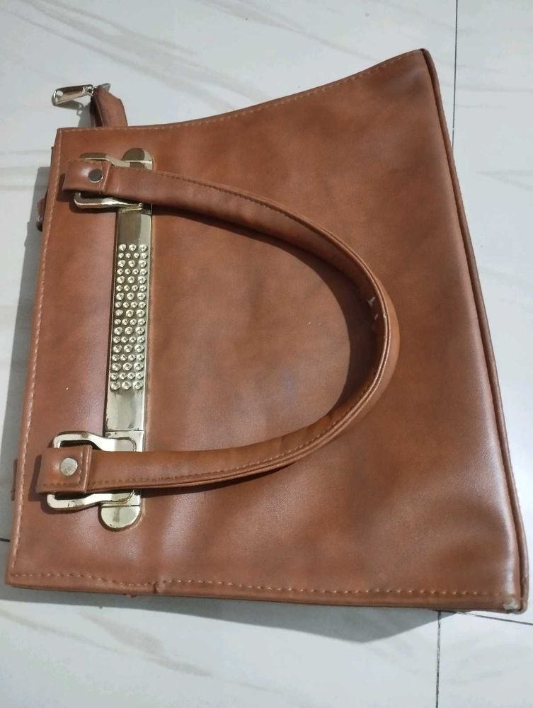 Chic Brown Handbag with Embellished Handle