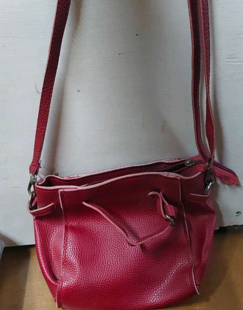 Red sling purse