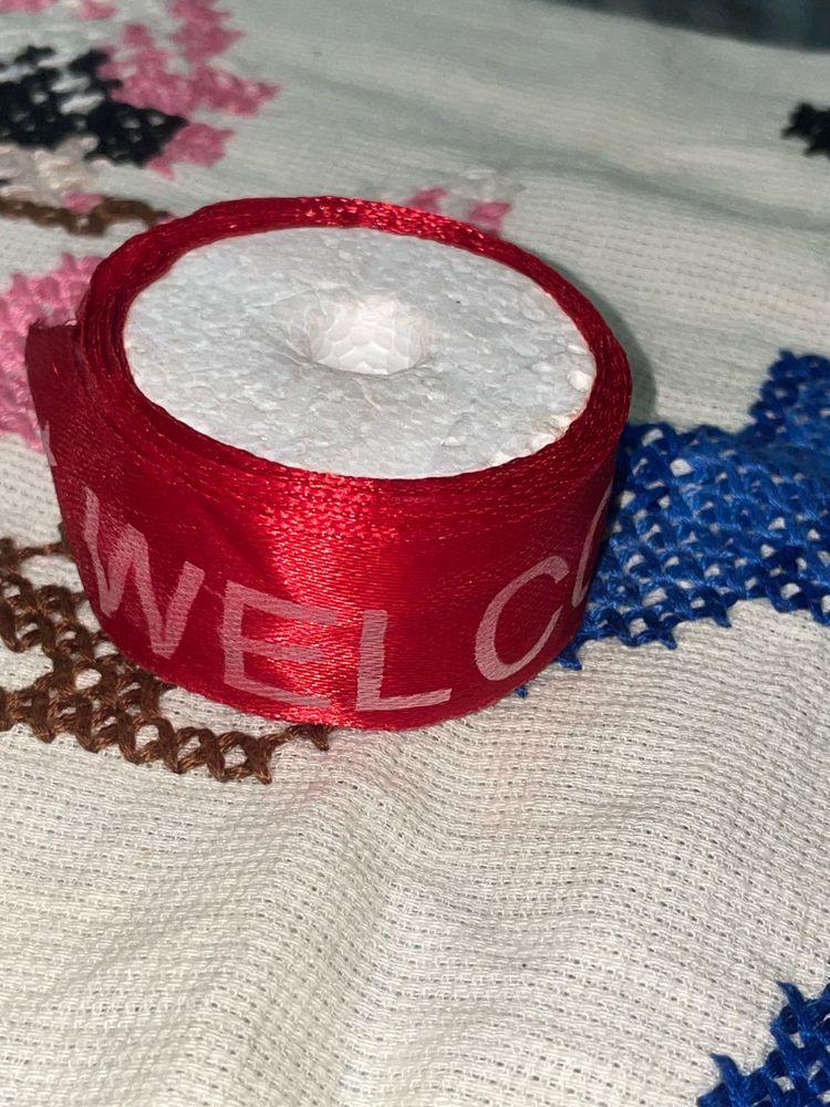 Red Ribbon with "Welcome" Text