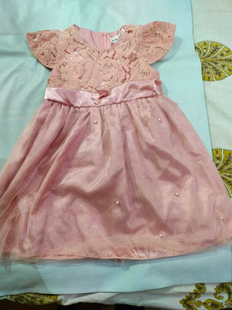 A Used Baby Girl Peach Color Frock