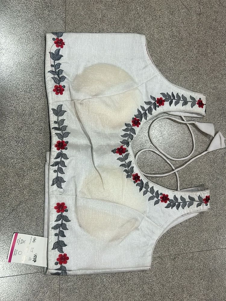 Embroidered White Sleeveless Blouse