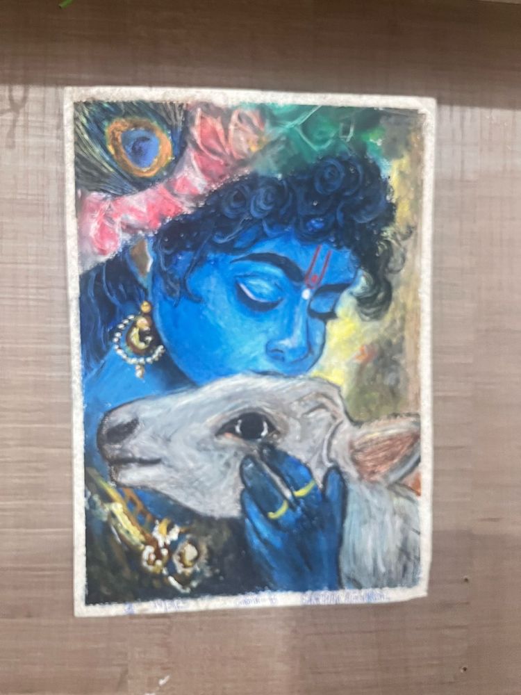 A krishna ji painting with cow