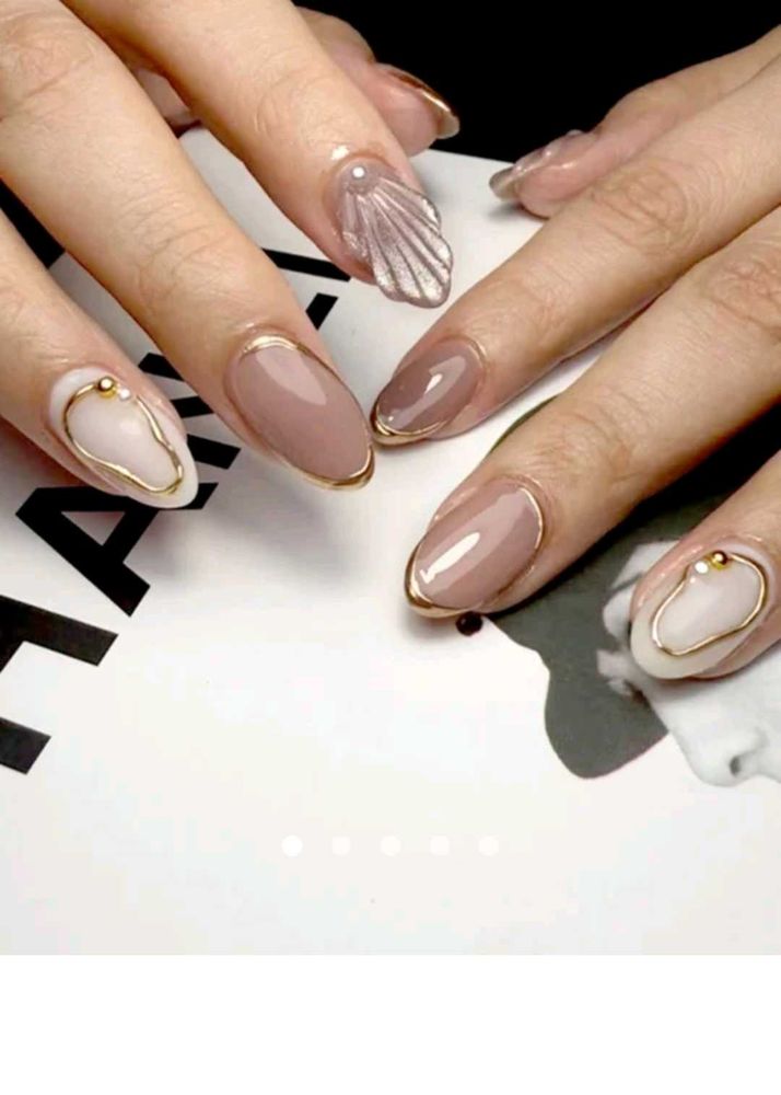 Elegant Almond Nails with Gold Accent