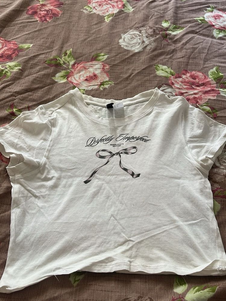 Chic White Graphic Tee with Bow Detail