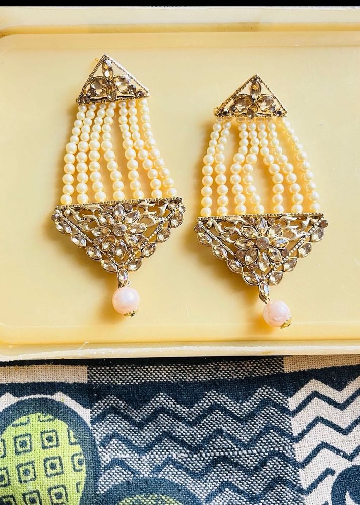 heavy gold and pearl earrings