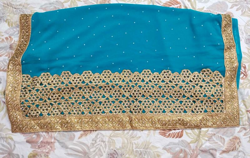 Teal Saree with Gold Border