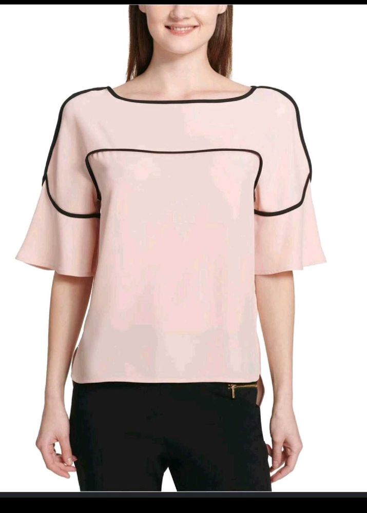 Calvin Klein Women's soft pink hue or light cream.