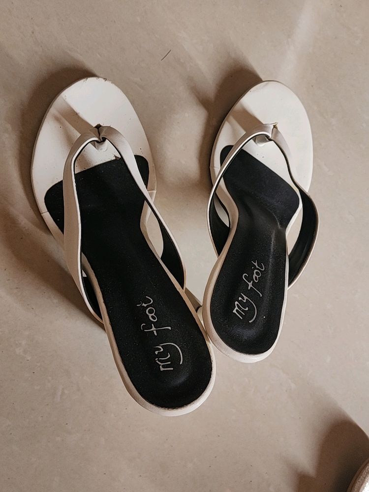 A Pair Of White Heels