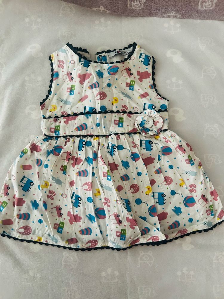 infant's white sleeveless cotton muslin frock