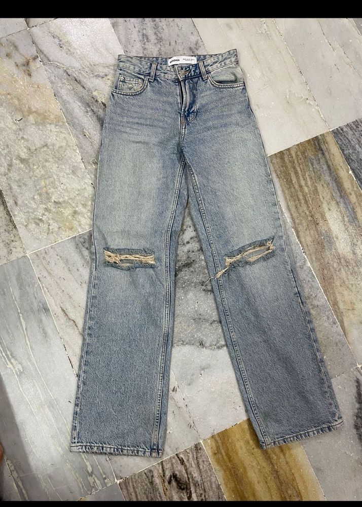 Distressed Light Wash Denim Jeans