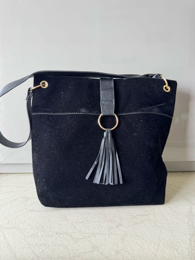 Chic Black Suede Shoulder Bag with Tassel Detail