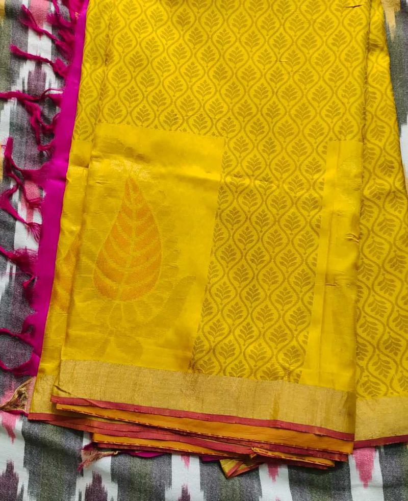 Vibrant Yellow Saree with Intricate Pattern