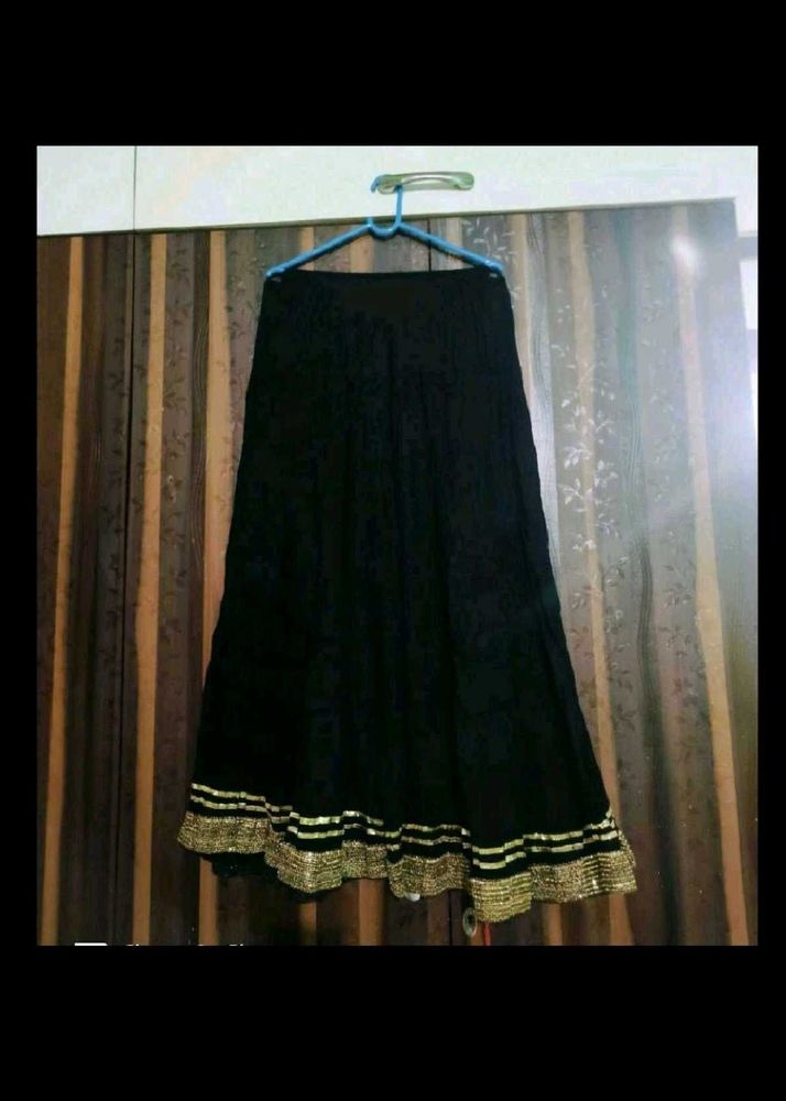 Elegant Black Skirt with Gold Border