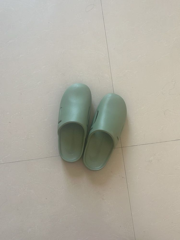 Mint Green Slides Nike brand.
