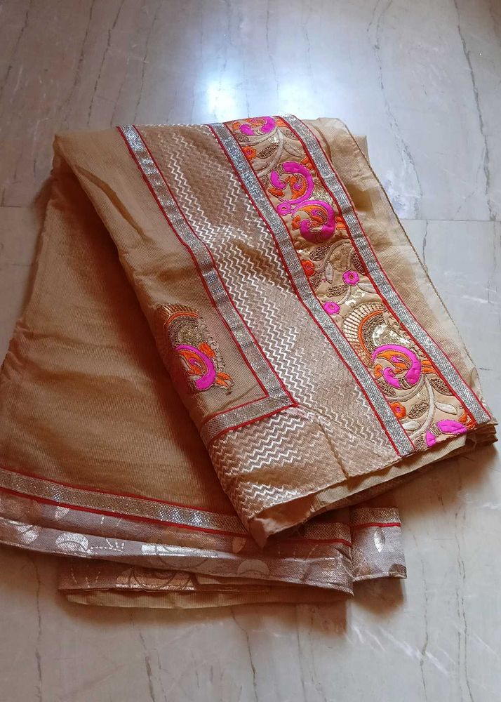 Elegant Beige colour Embroidered Saree