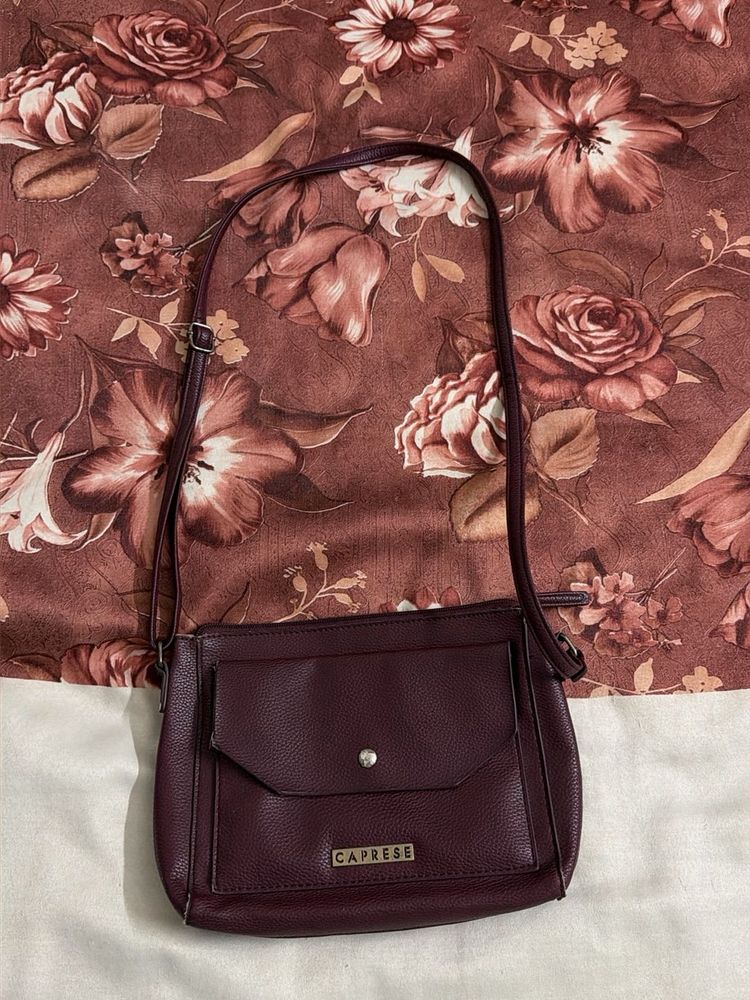 Caprese Burgundy leather sling bag