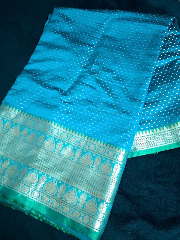 Beautiful Teal Saree with Gold Border