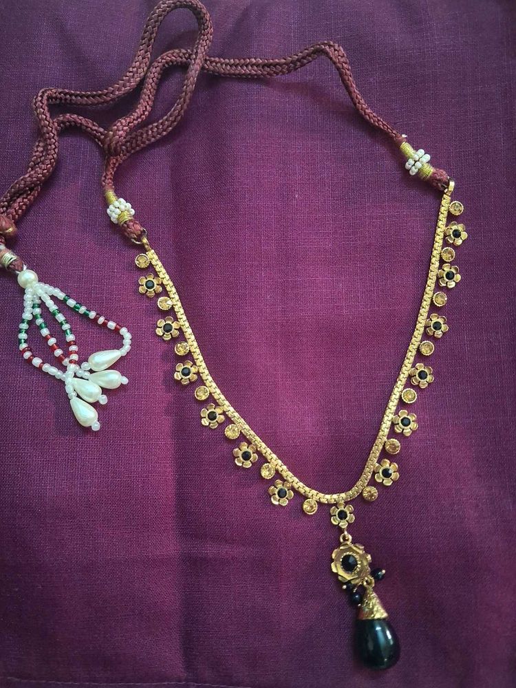 Elegant Gold Tone Necklace with Black Pendant