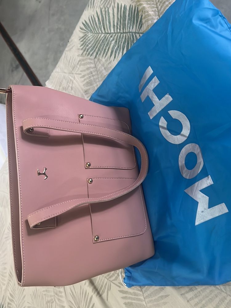 Brand Mochi Pink Solid Handheld Bag,has a Zip Closure 1 Main Compartment Two Handler