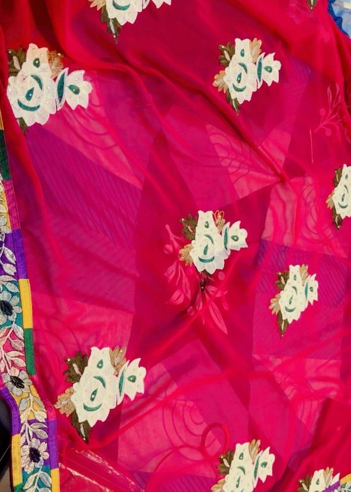 Vibrant magenta and green Floral Embroidered Saree