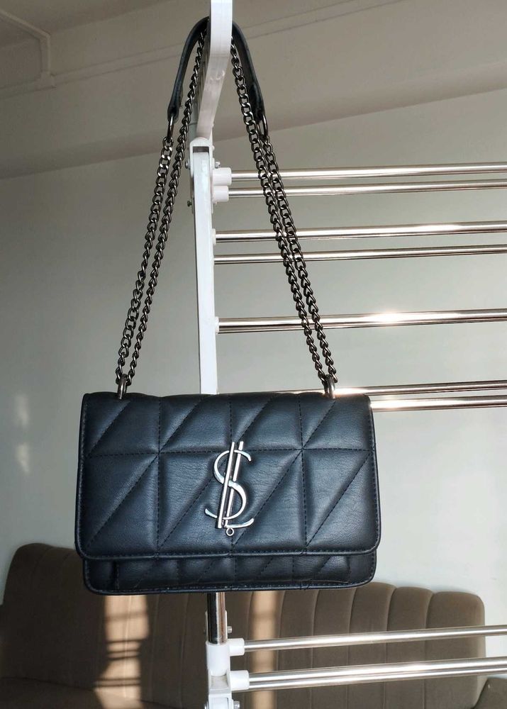 Black sling bag.