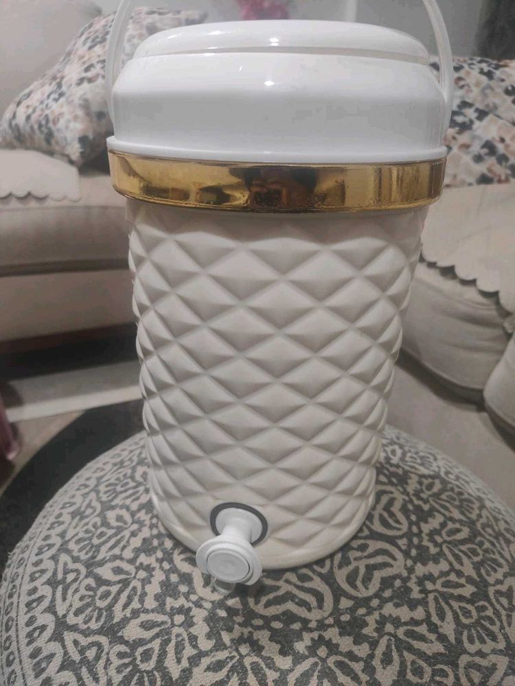 Elegant Water Dispenser with Gold Trim