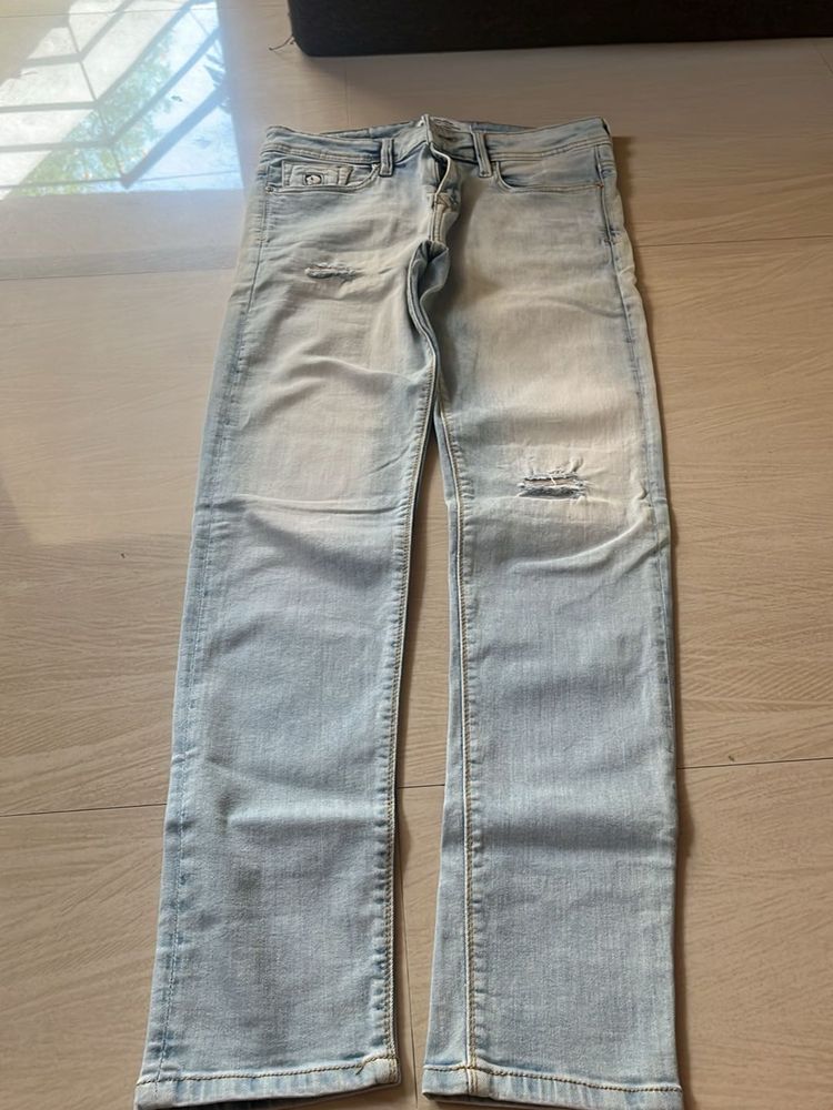 Light Wash Distressed Denim Jeans