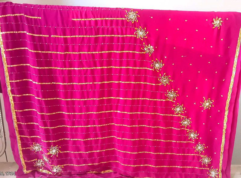 Elegant Pink Saree with Gold Embellishments
