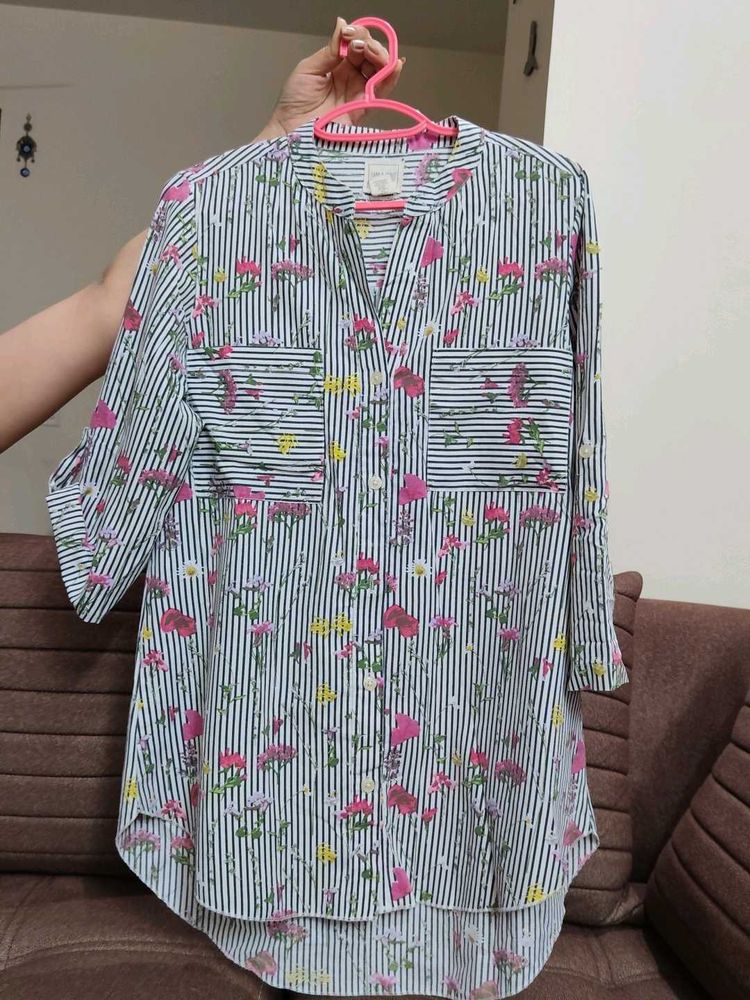 A striped black and white floral shirt.