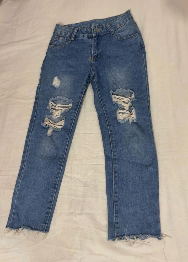 Distressed Blue Denim Jeans
