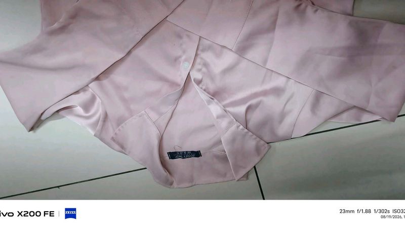 it's a peach pink colour full sleeve, crop shirt
