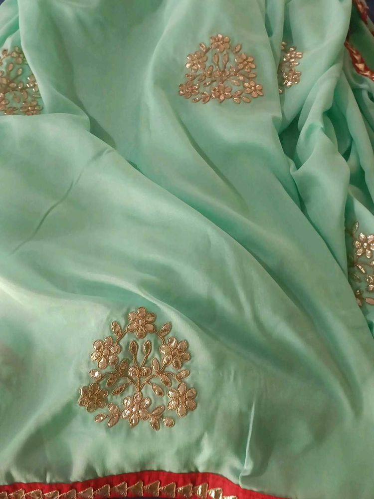 Elegant Mint Green Saree with Gold Embroidery