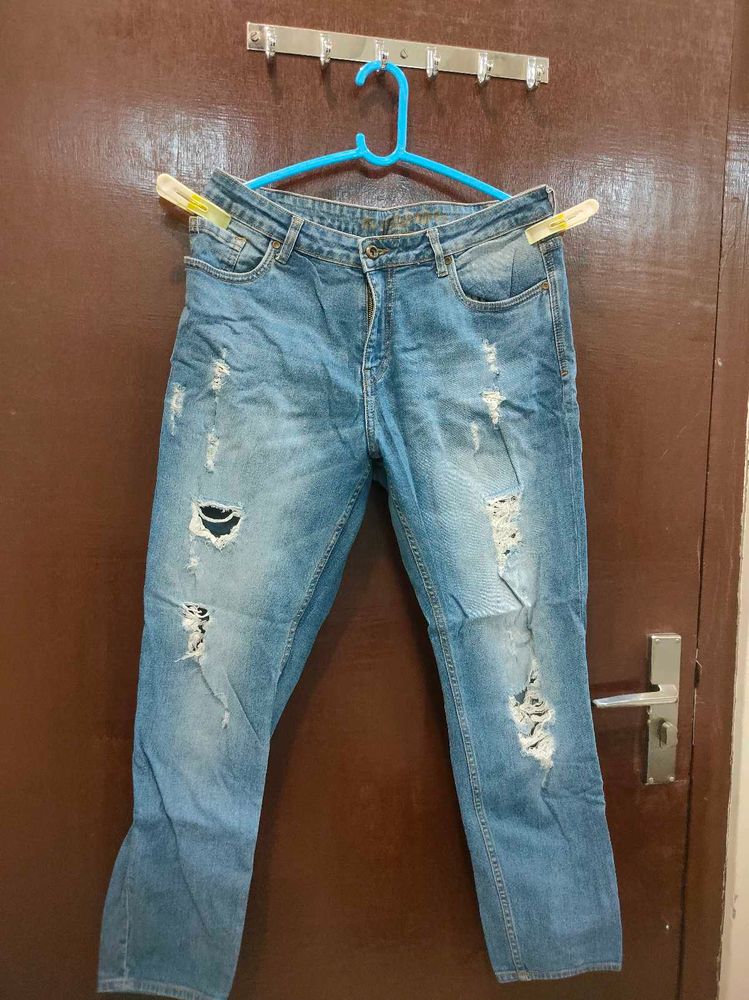 Distressed Blue Denim Jeans