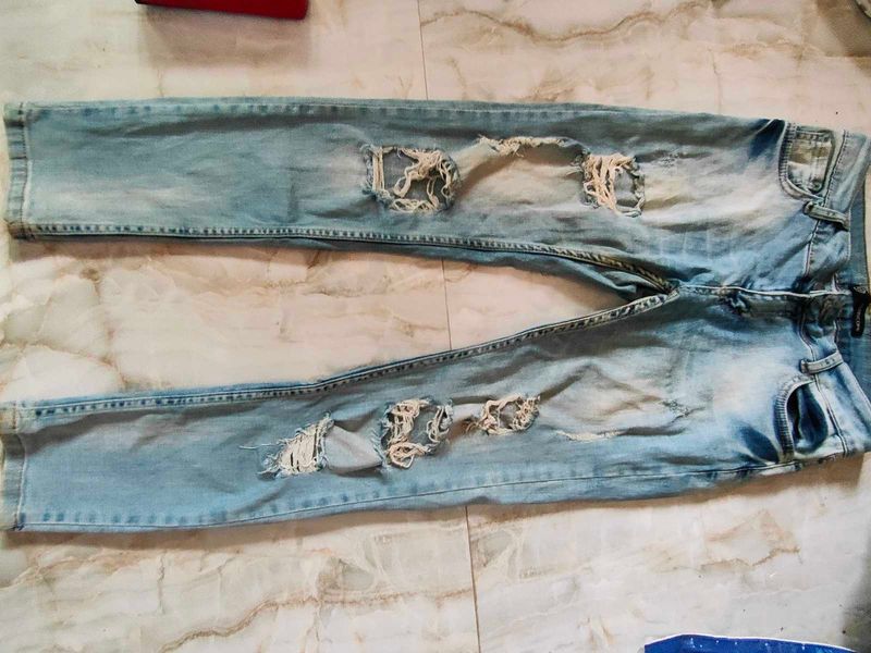 Ripped Light Wash Denim Jeans