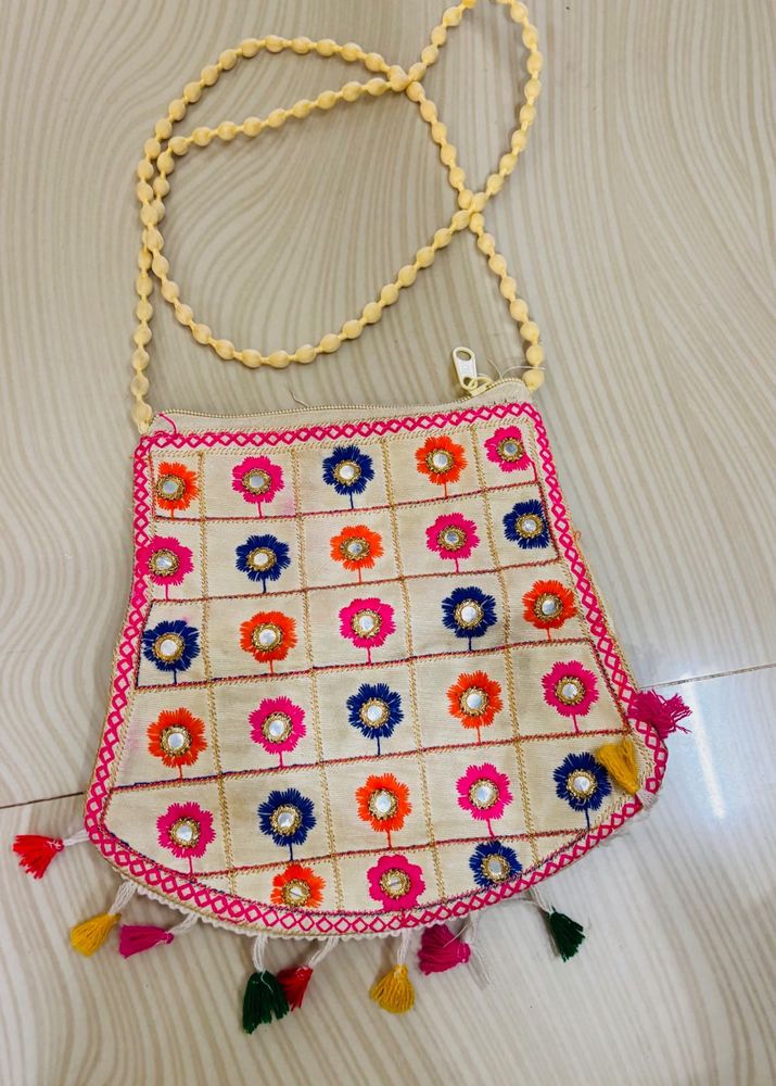 Embroidered Clutch with Tassels