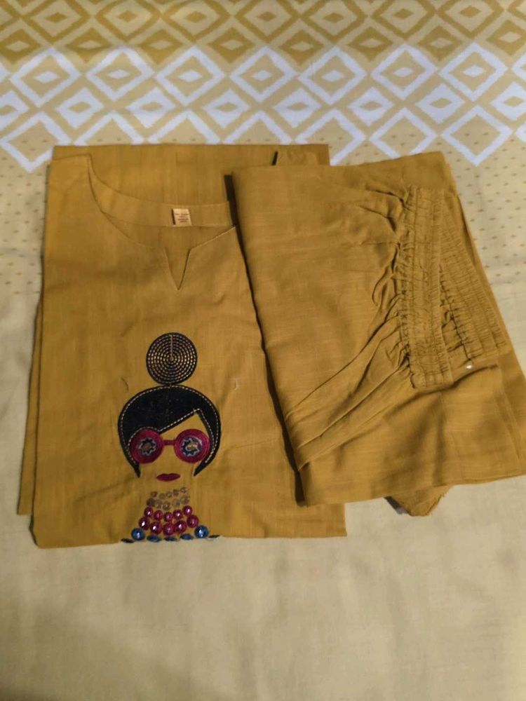 Stylish Mustard Kurta Set with Embellished Necklin