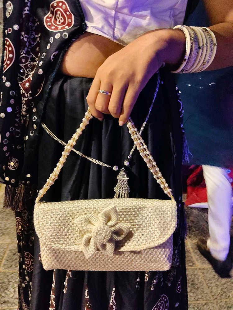 Elegant Woven Clutch Bag with Flower Detail