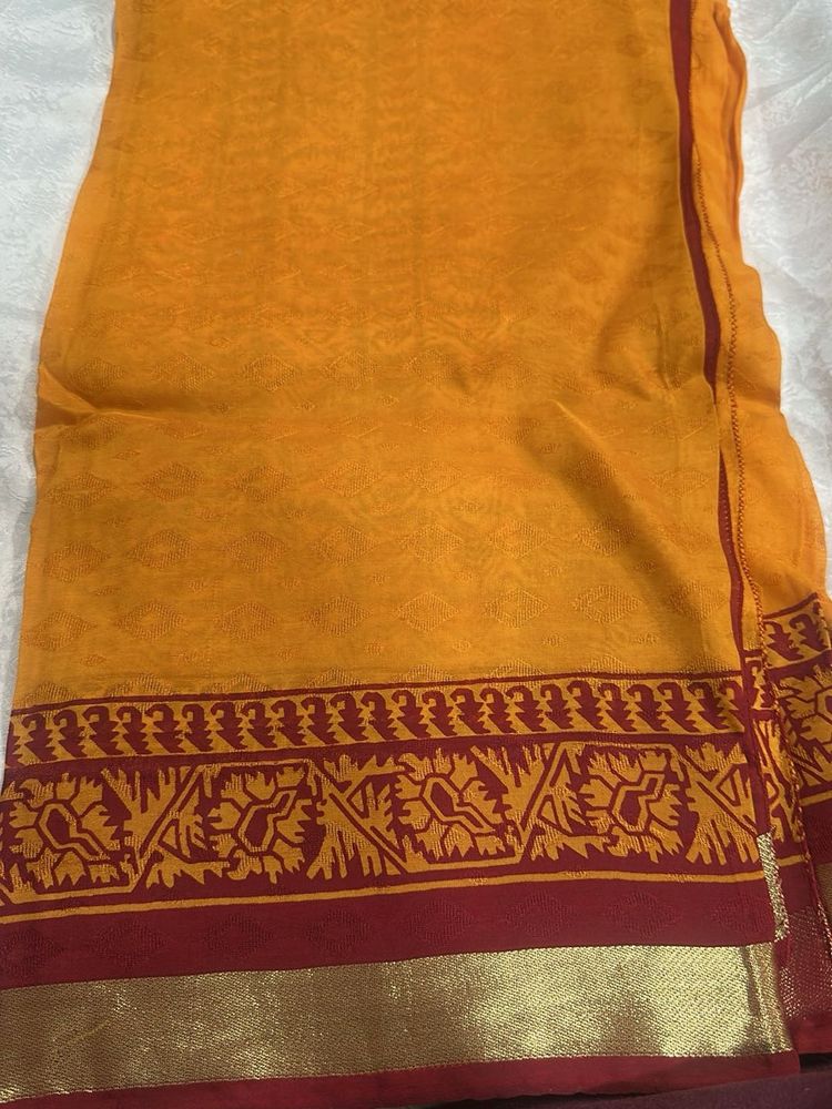 Vibrant Orange Saree with Maroon Border