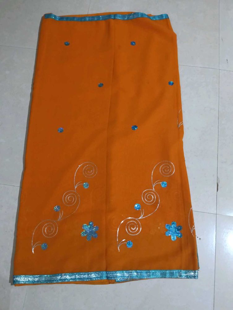 Orange Saree with Blue Embellishments