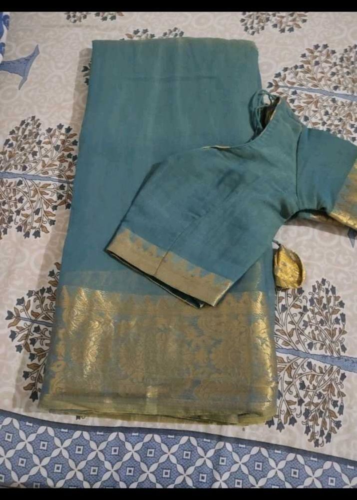 Elegant Teal Saree with Gold Border
