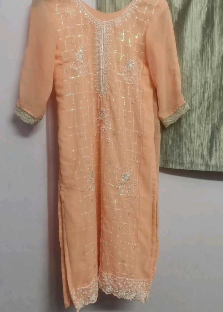 orange kurta set with beads work