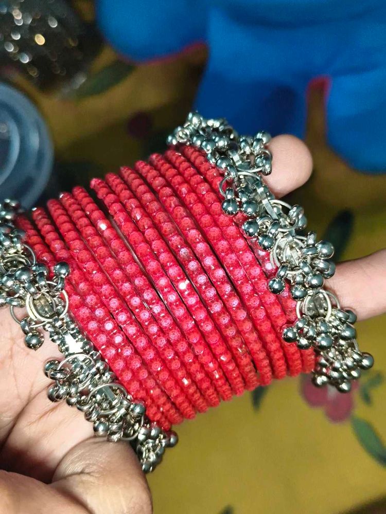 Vibrant Red Bangles with Silver Charms