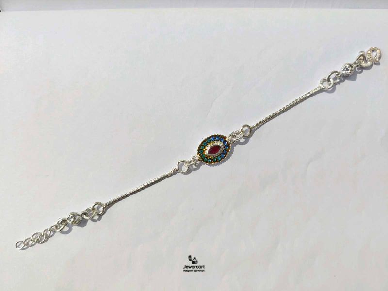 Elegant Pure Silver Oval Stone Rakhi