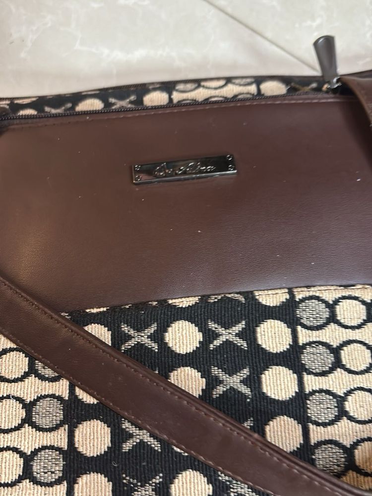 Chic Brown Handbag with Unique Pattern