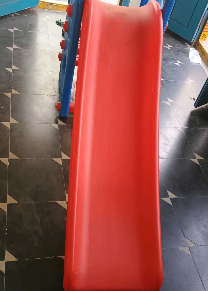 Bright Red Plastic Slide