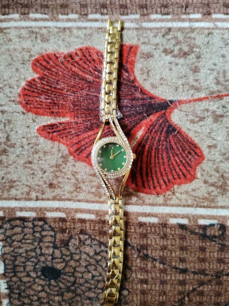 Elegant Gold Watch with Green Dial