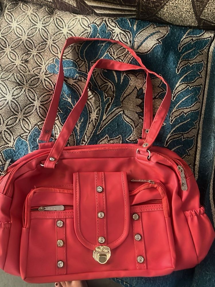 Chic Coral Handbag with Embellishments