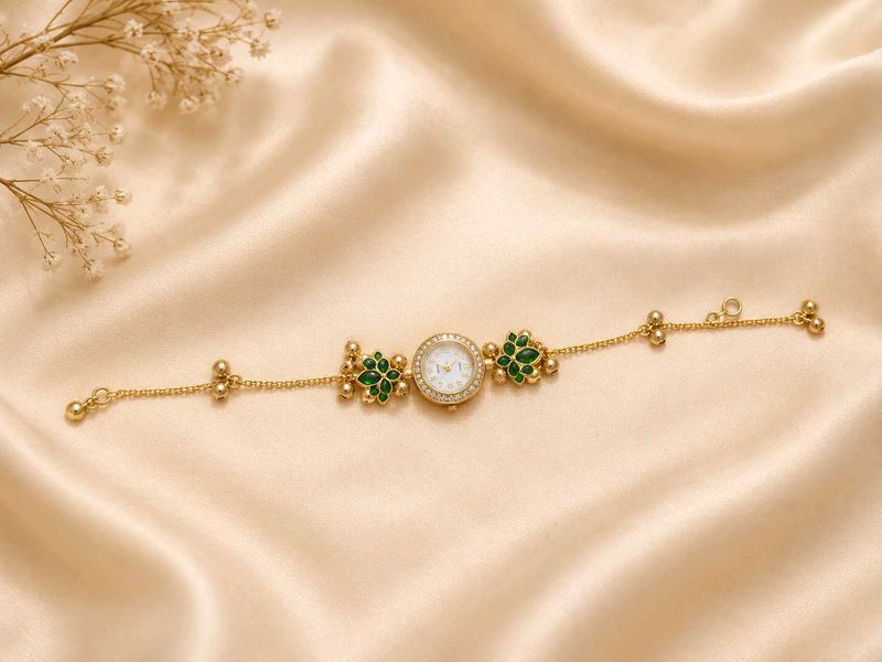 Elegant Gold and Emerald Bracelet Watch
