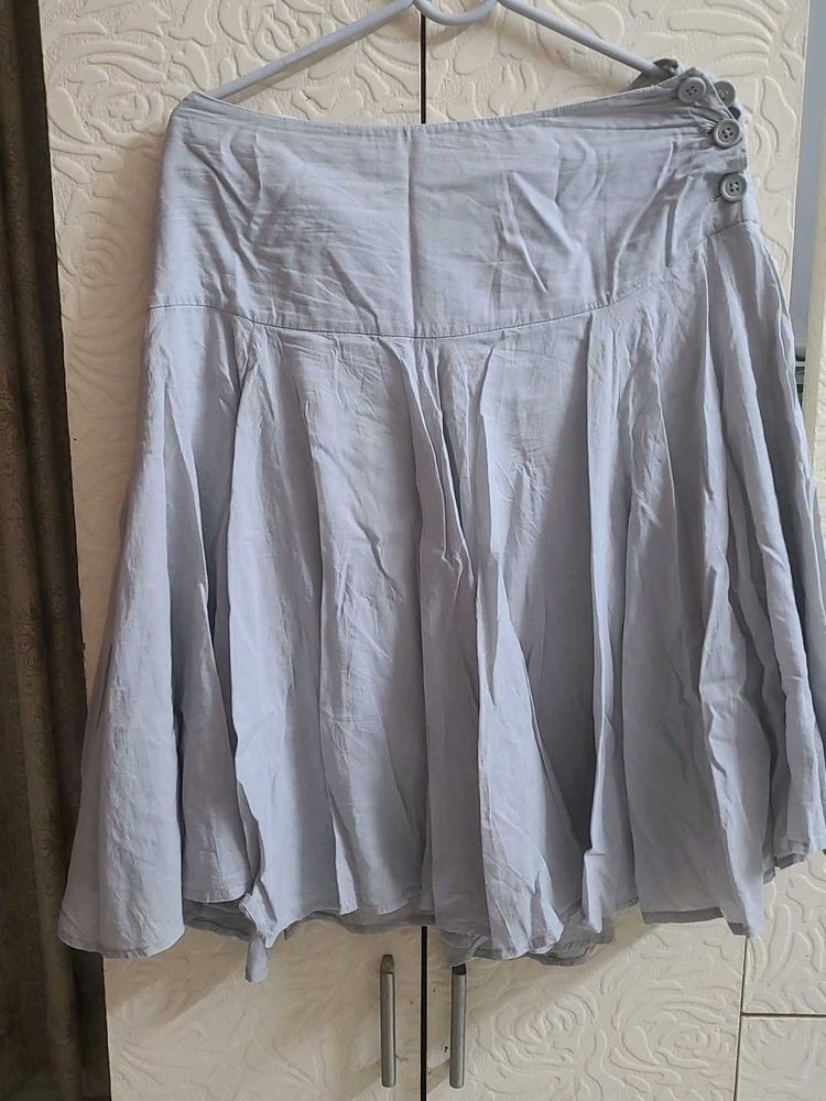 Light Blue Pleated Skirt with Button Detail