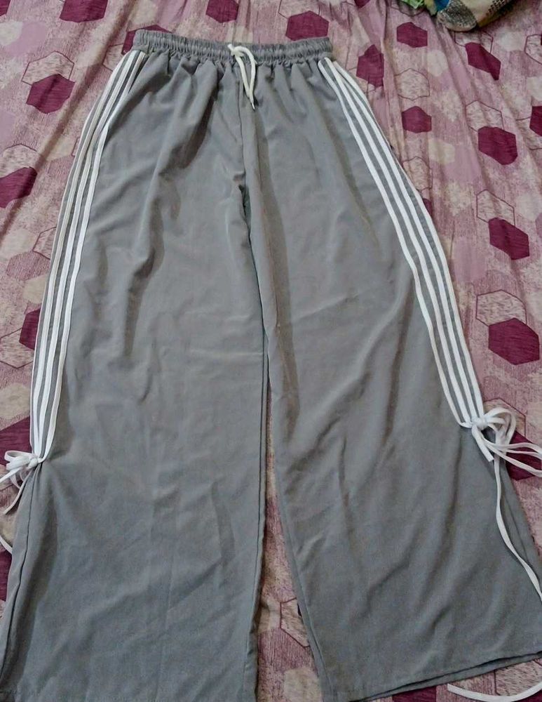 A grey flared, casual pants.